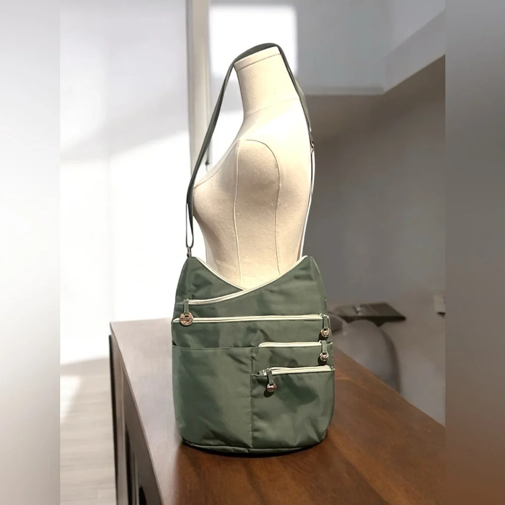 Travelon Anti-theft Crossbody Bag with 7 compartments green.